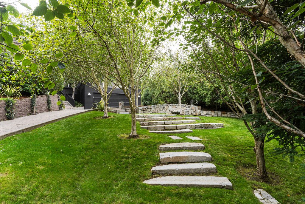 Front entrance with stepping stones made from city curbs. Photo: David Duncan Livingston for Sotheby’s International Realty.